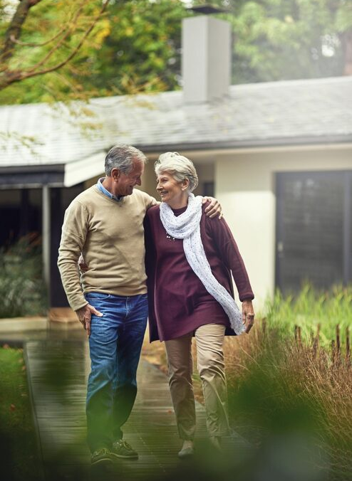 conversation-love-elderly-couple-walking-their-garden