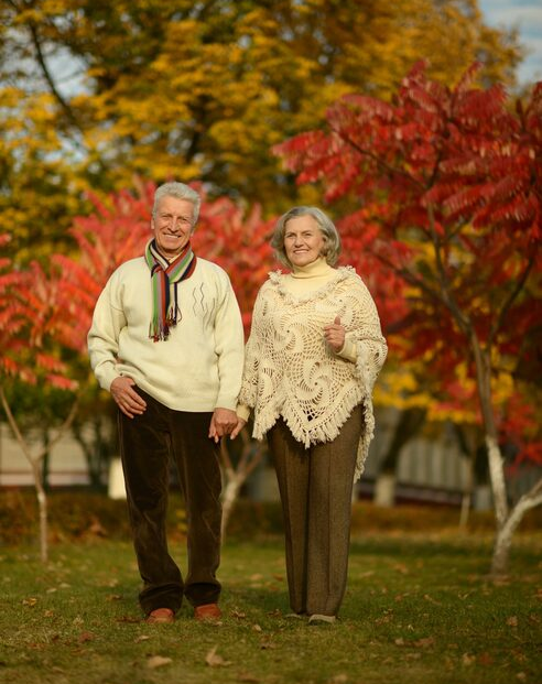 mature-couple-walking-autumn-park